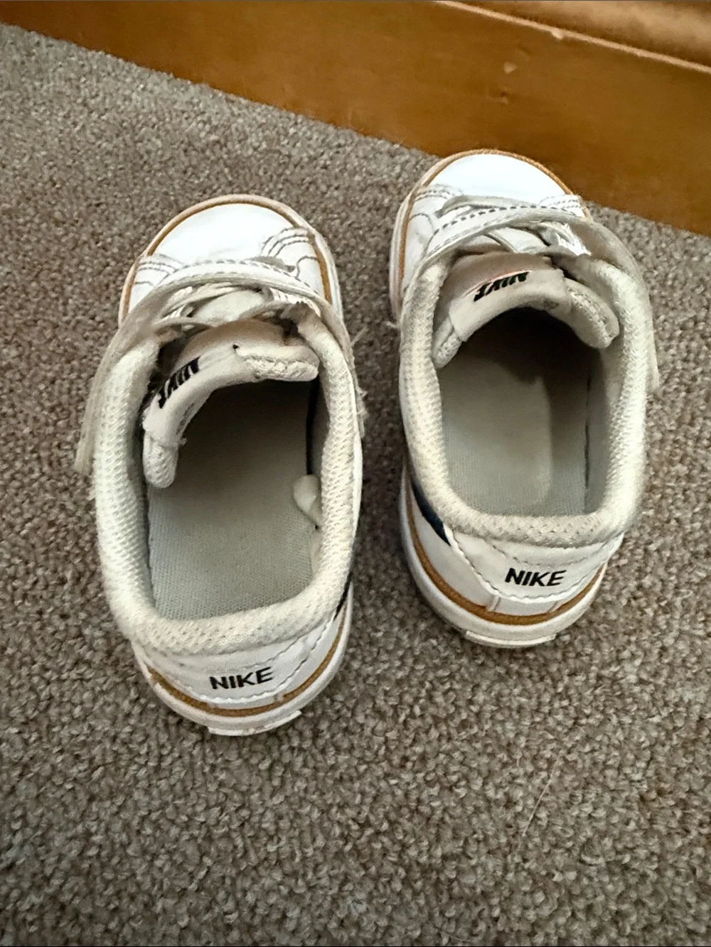 Nike Kids White Sneakers with Black Swoosh and Brown Trim